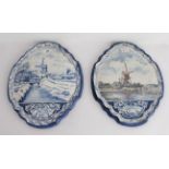 A pair of late 19th to early 20th century quatrefoil-shaped Dutch Delft wall-hanging pottery