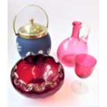 Four pieces of glassware: a 19th century cranberry glass carafe with star-cut base; a Venetian-style