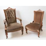 A fine pair (grandfather and grandmother) carved walnut and buttonback upholstered chairs: the