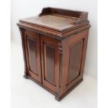 A rare late-19th century walnut cased cabinet sewing machine by the Domestic Sewing Machine