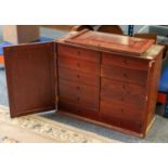 A large 19th century stained wood 11-drawer tool chest containing a variety of engineer's tools
