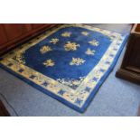 A blue ground carpet think pile Chinese carpet decorated with floral sprigs (192cm x 153cm)