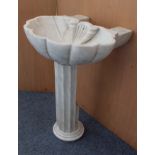 An early 19th century carved white Italian marble sink; the bowl formed as a giant clam shell and