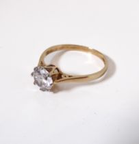 A 9-carat yellow gold solitaire dress ring: centrally set with a white stone of good quality and