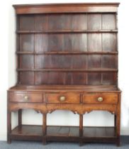 A late 18th century George III period oak potboard dresser: the shelved superstructure of pleasing