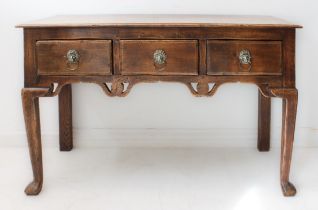 An 18th century style (good modern heavy reproduction) oak dresser base of small proportions: the