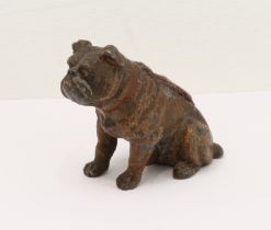 An 19th century cold-painted pin cushion in the form of a seated bulldog.