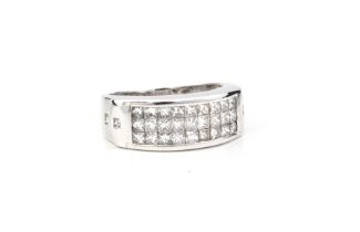 An 18ct white gold and diamond three row ring