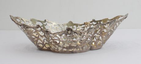 A late 19th century silver quatreform bonbon dish with two handles and pierced foliate scrolls,