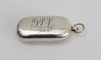 An Edwardian hallmarked silver double sovereign-holder of oval form: the hinged and sprung lid