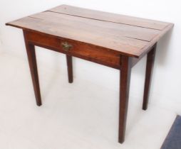 An early 18th century joined-oak side table: overhanging cleated three-plank top; single full-