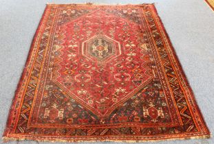 A south-west Persian Shiraz rug: probably 20th century, the central eight sided medallion on a six-