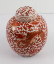 An early 20th century Chinese porcelain jar and cover: hand gilded and decorated in iron oxide red