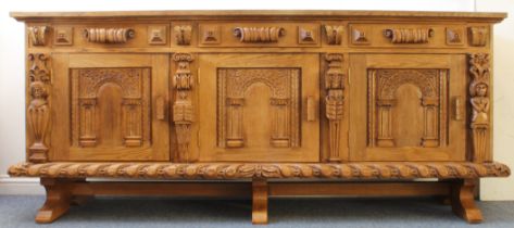 An extremely large and imposing handmade solid oak sideboard: slightly overhanging planked top above