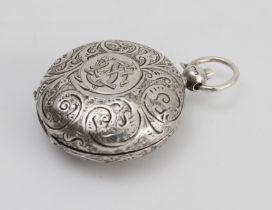 A circular hallmarked silver sovereign-holder with hinged sprung lid: the front engraved with