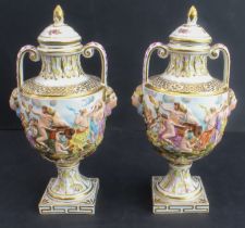 A pair of late 19th century Capo di Monte porcelain urns and covers: hand-gilded and the handles