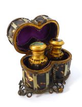 A 19th century gilt-metal mounted and tortoiseshell double-scent bottle holder: the hinged lid