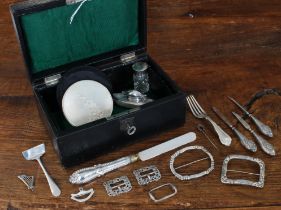 An early 20th century black leather jewellery box containing a variety of small silverwares and