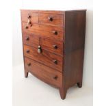 A mid-19th century mahogany two-part chest of drawers: two half-width over four full-width graduated