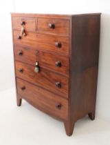 A mid-19th century mahogany two-part chest of drawers: two half-width over four full-width graduated