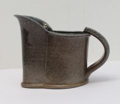 WALTER KEELER (b. 1942) - a saltglaze stoneware jug, mottled grey glaze and pear-shaped base. (12.75