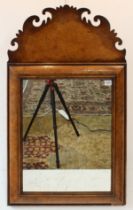 A walnut looking glass in late 17th to early 18th century style (a good reproduction): the highly