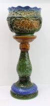 A 19th century style majolica jardinière on stand with leaf moulded decoration (78.5 cm high)