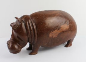 A well carved and modelled African hardwood carving of a hippopotamus: probably early to mid 20th