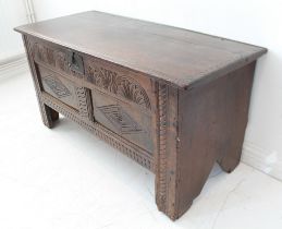 A good 17th century boarded oak chest of pleasing colour and proportions: scratch-moulded planed top