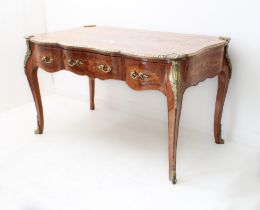 A Louis XVI style kingwood, rosewood, mahogany and marquetry serpentine bureau-plat: fourth