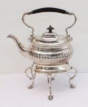 A heavy hallmarked silver spirit kettle on stand. The kettle with tapering fluted bowed ebony