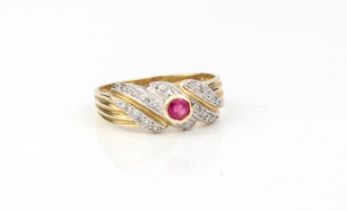 A 14ct yellow gold, ruby and diamond twist ring