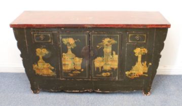 A Chinese painted and lacquered cabinet: probably early 20th century, the cleated, red lacquered top