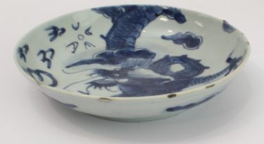 Ming Dynasty (1368-1644) - a Chinese porcelain dragon dish: four-clawed dragon in underglaze blue