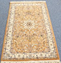 A Kashmir rug; light terracotta ground with ivory central medallion and main ivory border (156 x