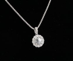 An 18ct white gold and diamond cluster pendant necklace - the principal round, mixed cut diamond,