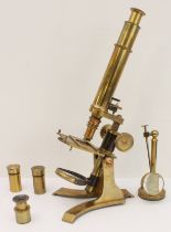 A mid-19th century brass monocular microscope: 8¼" main tube, rack and pinion adjustments, double
