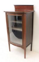 An Edwardian inlaid mahogany bowfronted display cabinet - the dentil banded top with inset