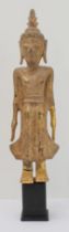 A giltwood figure of Buddha: Laos / Lanna, probably early 20th century, the standing figure with