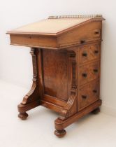 A  third quarter 19th century walnut Davenport by Gillow & Co. (stamped top side of top left
