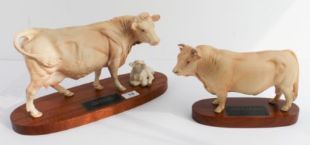 A Beswick 'Connoisseur' model, 'Charolais Cow and Calf' upon an oval stained mahogany base and a