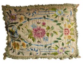 A large 19th century cushion: hand-stitched with varying sized cut flowers against silk, tassled
