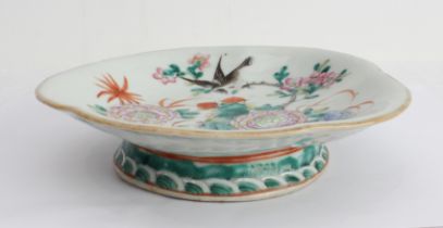 A 19th century flowerhead-shaped Chinese porcelain pedestal dish: hand-decorated in enamels with a