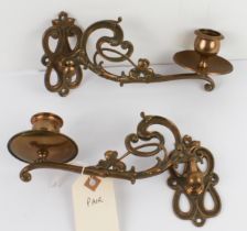 A pair of antique brass Art Nouveau candle sconces - early 20th century, of typically sinuous,