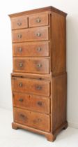 A walnut and crossbanded chest-on-chest of slim proportions in early 18th century style (later): the