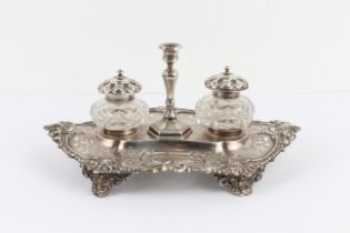 A mid 19th century hallmarked silver pierced boat-shaped desk stand: two silver-mounted and cut-