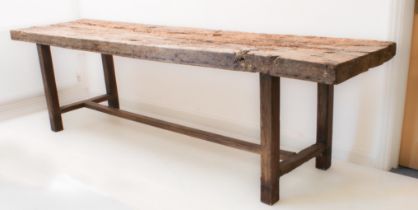 A 19th century rustic sycamore plank-topped refectory-style table - on square legs united by an H-