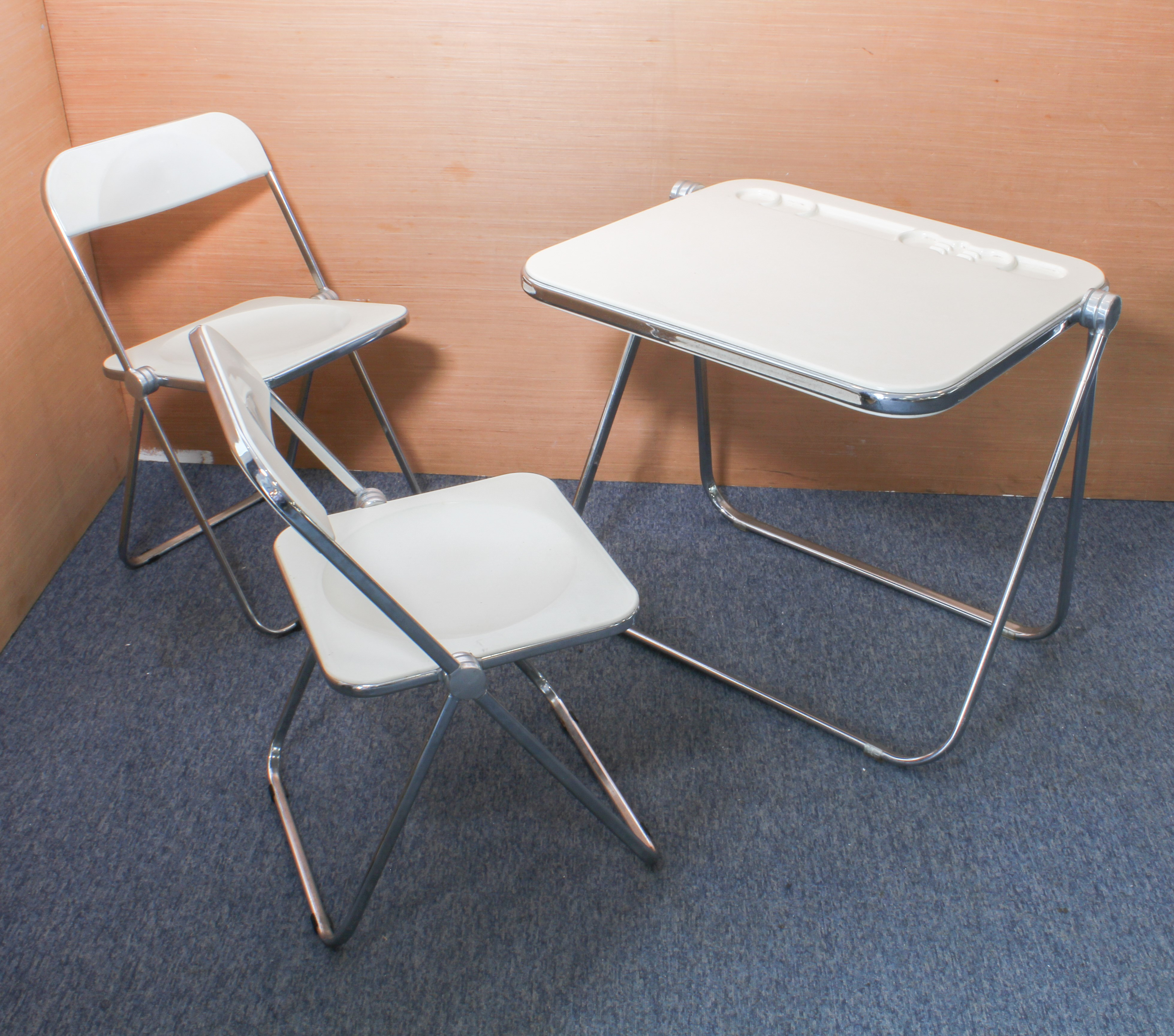 A 1970s Platone folding table or desk by Giancarlo Castelli of Italy and two matching Plia chairs: