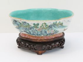 A 20th century Chinese porcelain bowl of quatrefoil form: matt duck-egg blue glazed interior; the