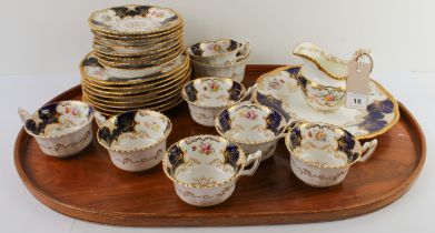 An early 20th century Coalport porcelain tea service. Each piece hand-gilded and decorated with